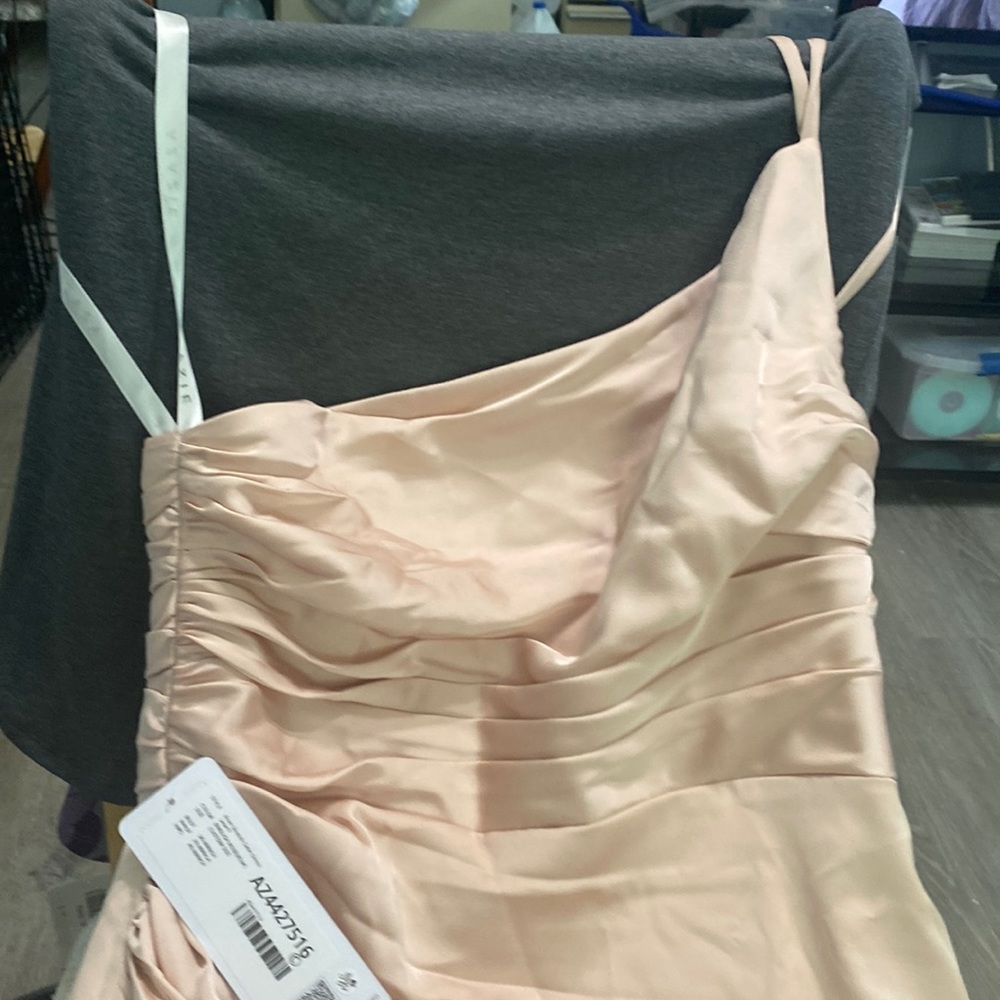 Formal women’s gown, floor length, one shoulder strap, peachy orange NWT.